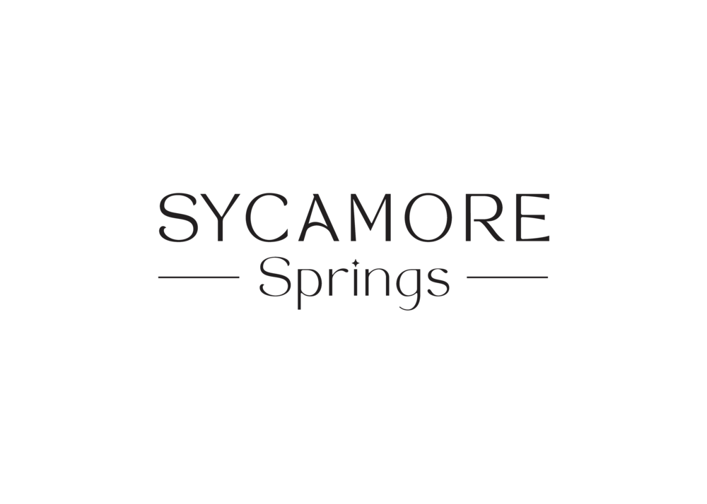A green background with the words SYCAMORE Springs centered in white.
